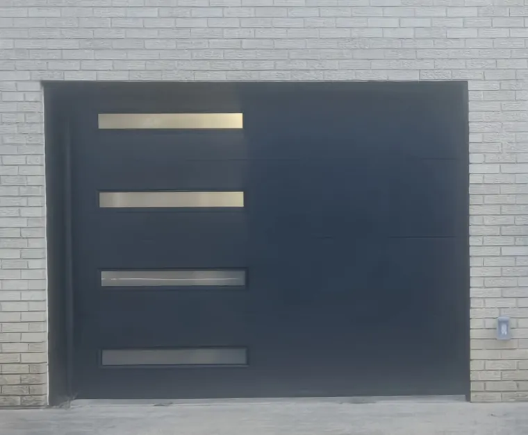A black modern garage door with four frosted glass strips set in light brick