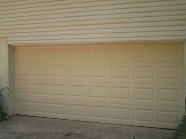 The same opening with a new almond raised-panel door